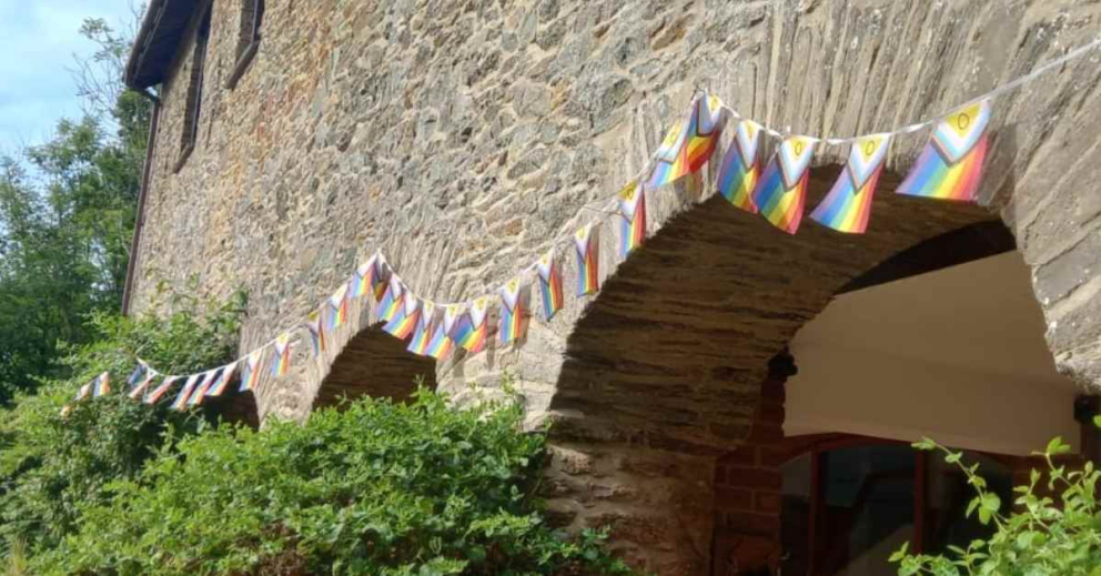 Inclusive bunting, heralding our LGBTQIA+ retreat at The Barn: Ease of Being
