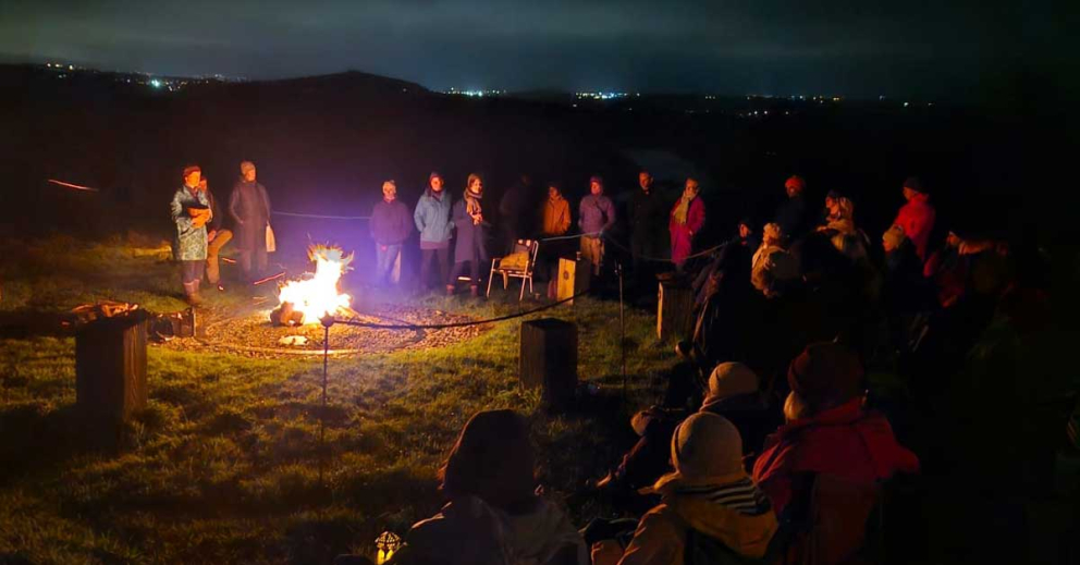 People around the Ancestors' Fire at our All Souls' Day ceremony at Sharpham Meadow Natural Burial Ground