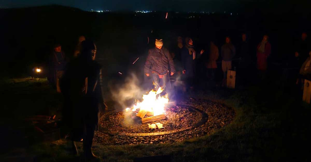 People around the Ancestors' Fire at our All Souls' Day ceremony at Sharpham Meadow Natural Burial Ground