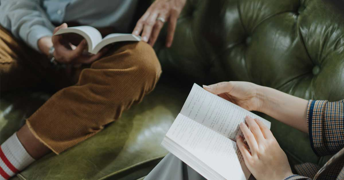 People reading on Sharpham Trust digital detox retreat