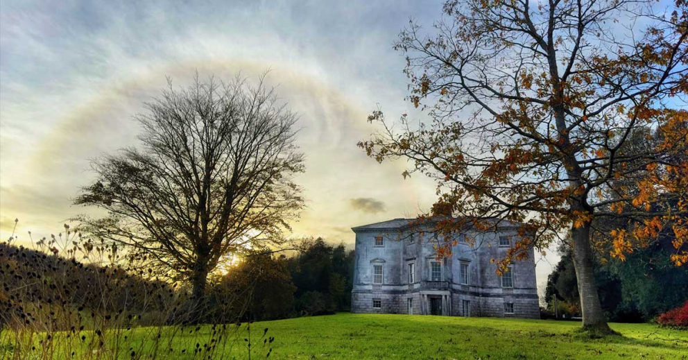 shot of Sharpham House with light halo