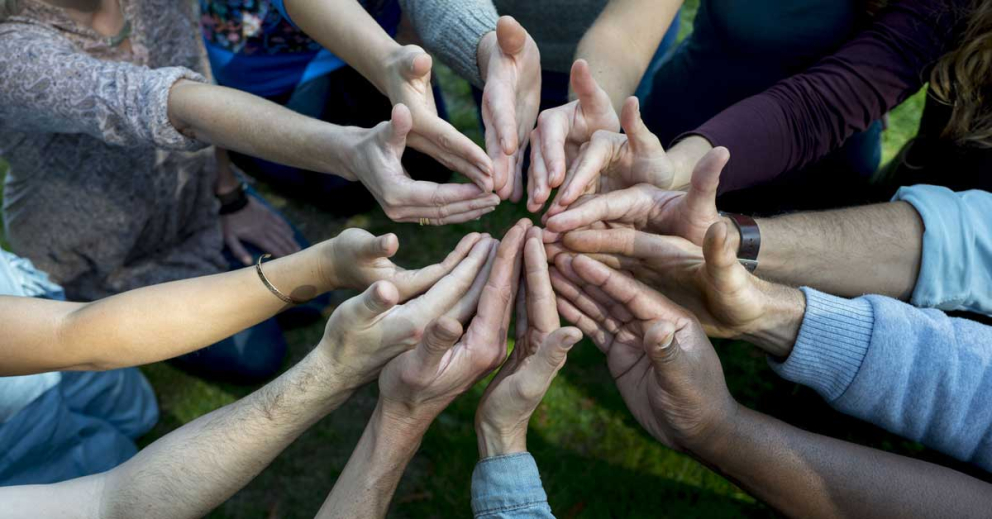 Hands connecting in a ring