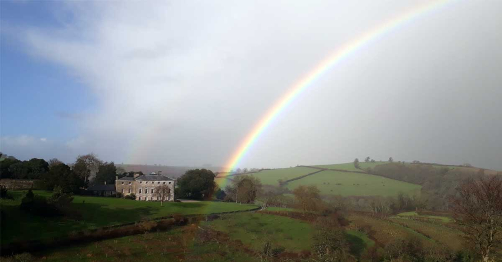Sharpham House and a rainbow