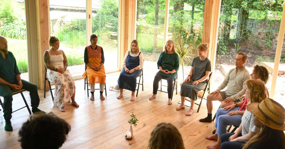 Retreatants meditate together in The Coach House