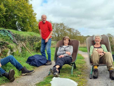 Volunteers rest after assisting in the organic orchards on the Sharpham Estate