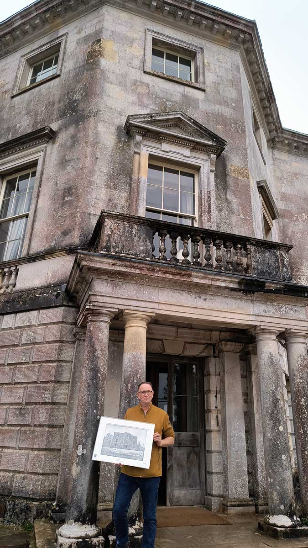 Artist Michael Crossan outside Sharpham House with his gift to The Sharpham Trust - his aquatint etching
