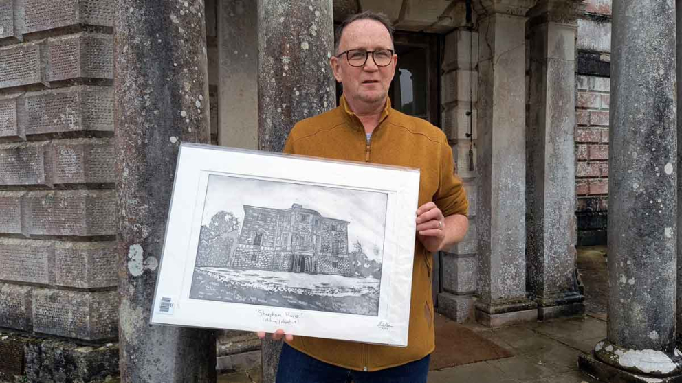 Artist Michael Crossan outside Sharpham House with his gift to The Sharpham Trust - his aquatint etching