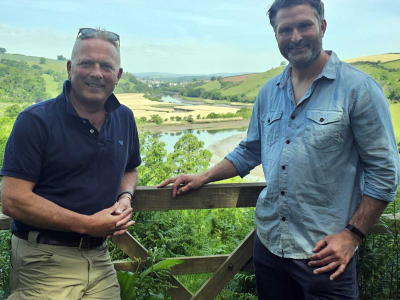 Presenter Jules Hudson (left) with Jack Skuse, from our rewilding partners Ambios, with our rewilding fields behind for the BBC's Escape to the Country property show