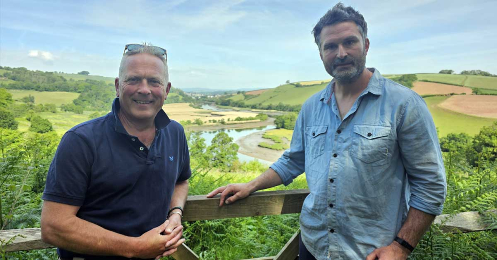 Presenter Jules Hudson (left) with Jack Skuse, from our rewilding partners Ambios, with our rewilding fields behind for the BBC's Escape to the Country property show