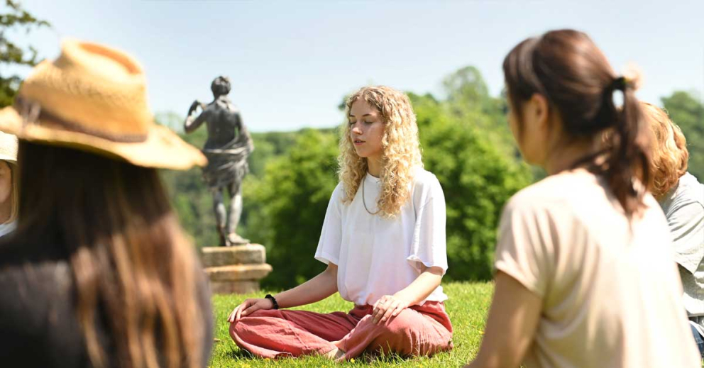 Young people meditate at Sharpham