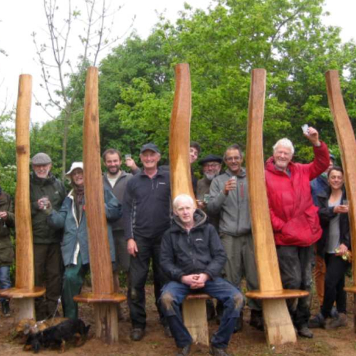 Volunteers who worked on creating the Green Oak Bench with wood artist Peter Lanyon, as part of a project funded by the National Lottery Heritage Fund