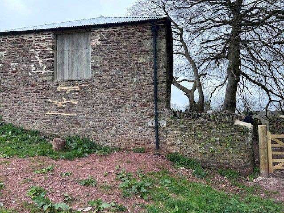 The restored Devon linhay barn at Point Field on the Sharpham Estate