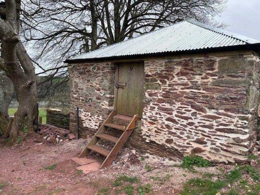 The restored Devon linhay barn at Point Field on the Sharpham Estate