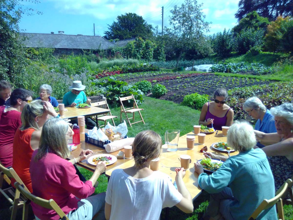Volunteers enjoy a Harvest Feast in the Walled Garden at Sharpham House