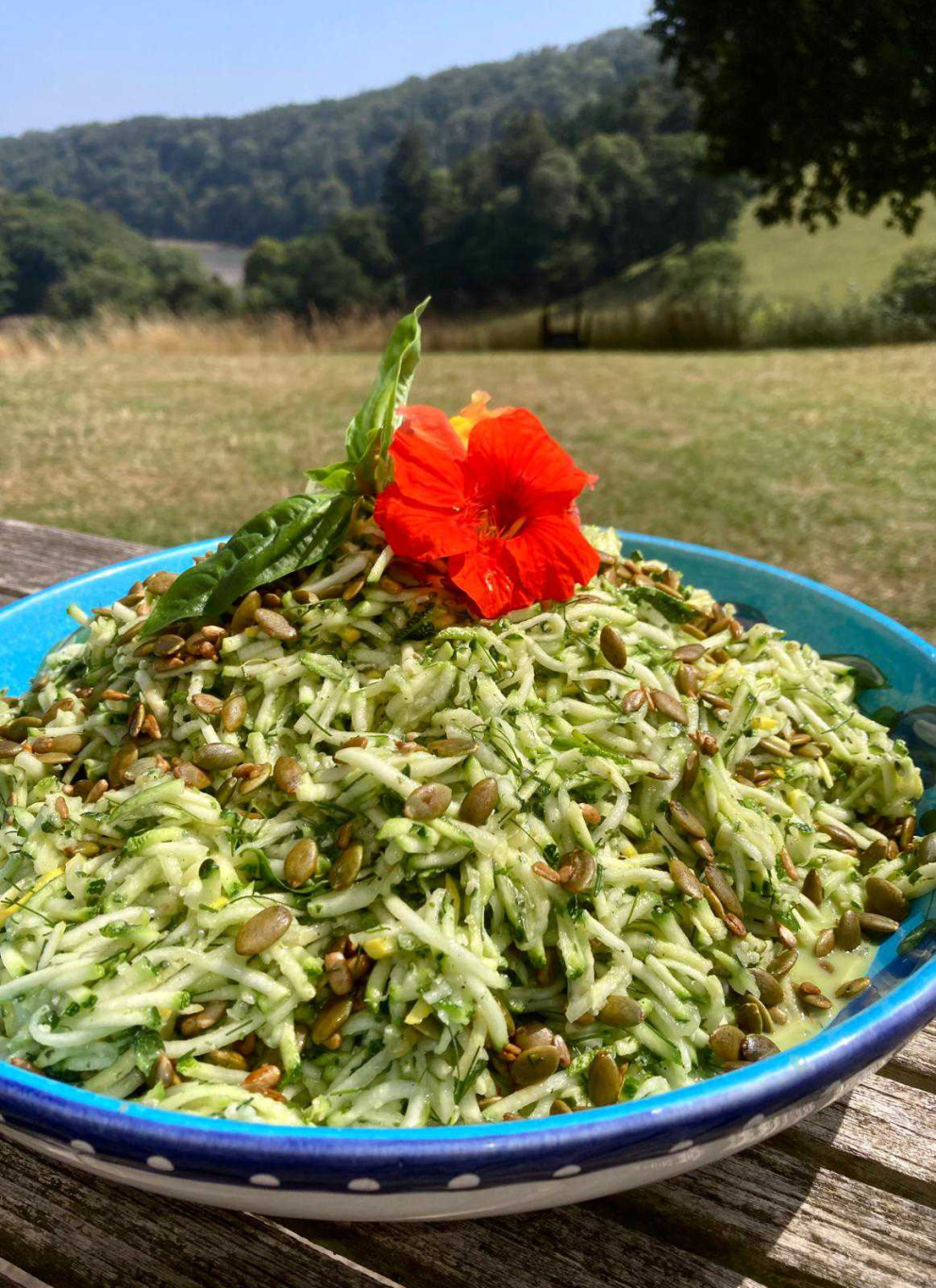 Courgette and basil vegan pesto salad, served on the sunny South Terrace at Sharpham House, looking down the River Dart