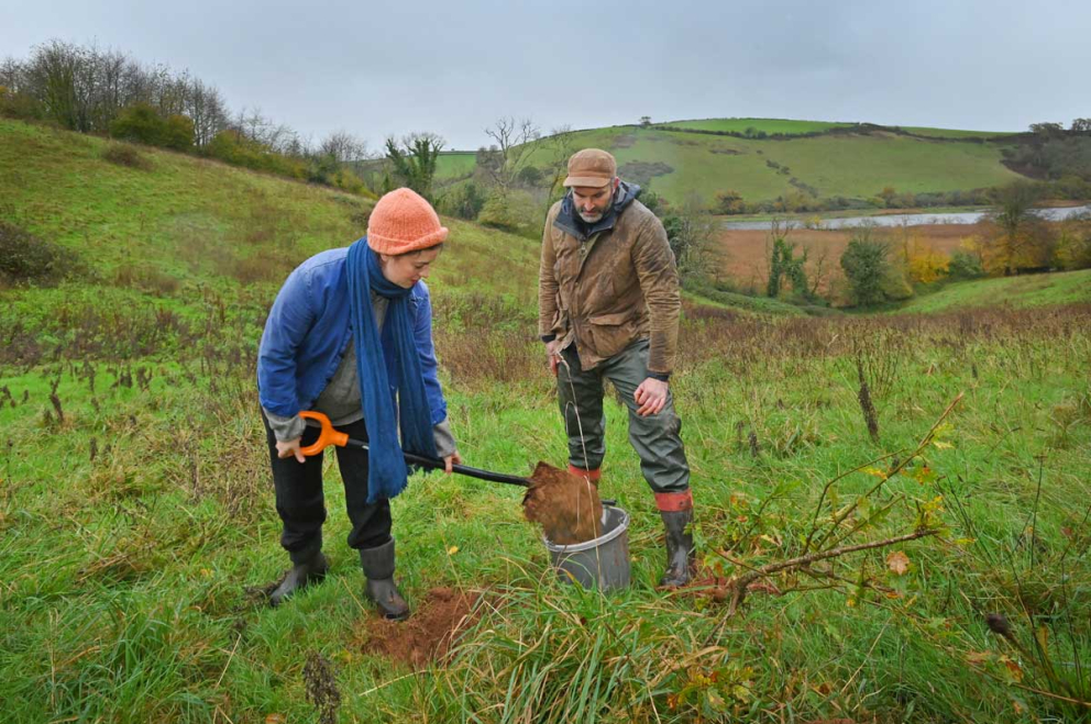 Frances Tophill & Jack Skuse plant an oak tree on the Sharpham Estate for National Tree Week