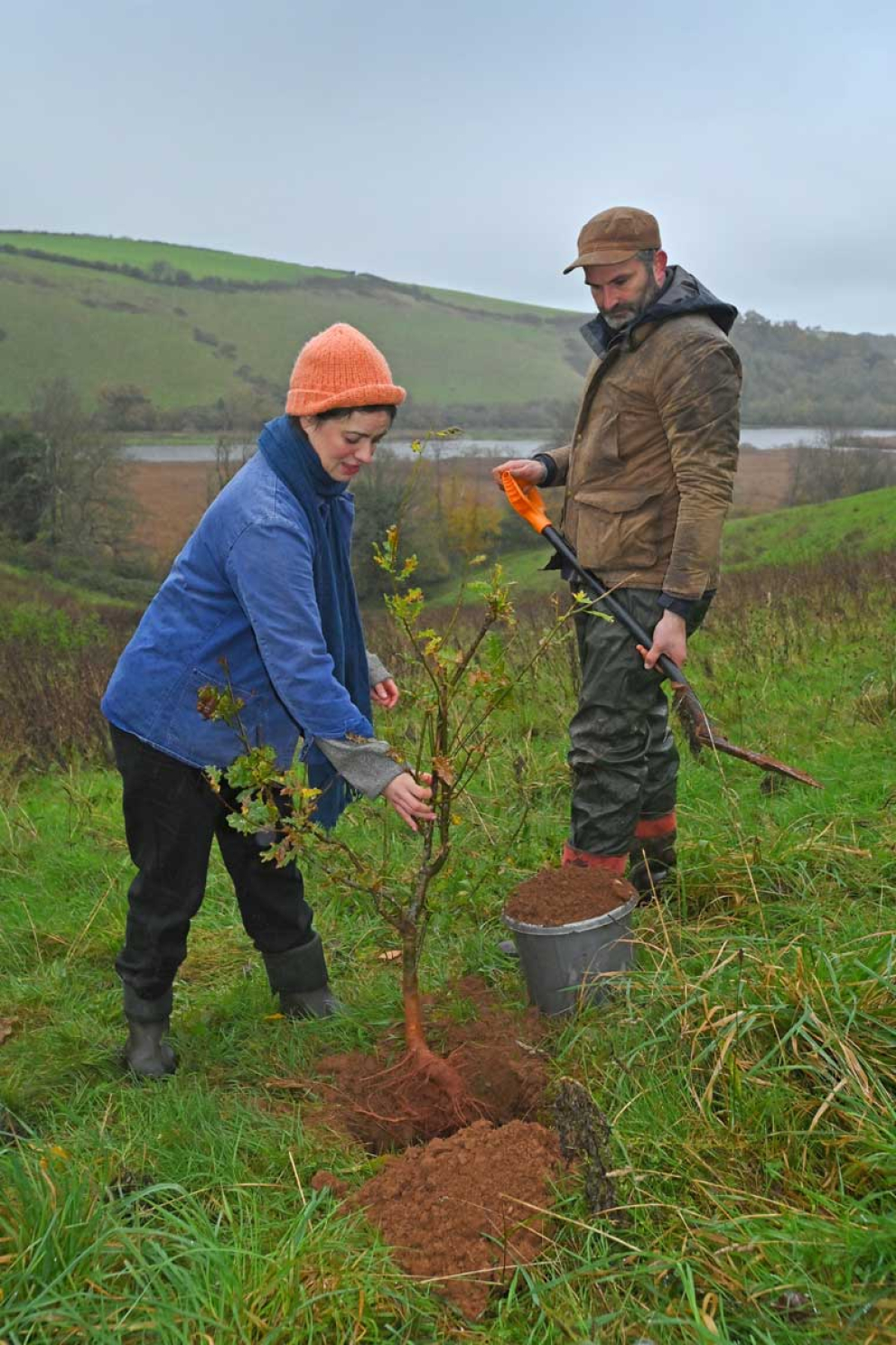 Frances Tophill & Jack Skuse plant an oak tree on the Sharpham Estate for National Tree Week