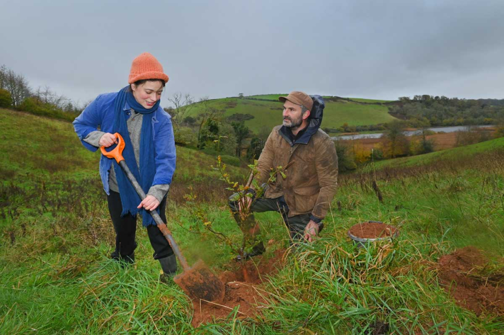 Frances Tophill & Jack Skuse plant an oak tree on the Sharpham Estate for National Tree Week