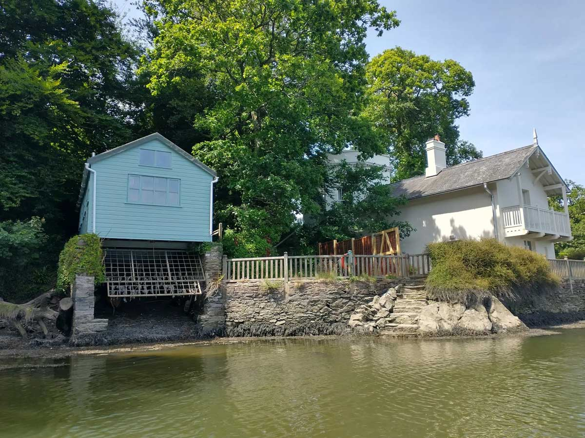 The Boat House, besides the historic Bathing House on the River Dart at Sharpham